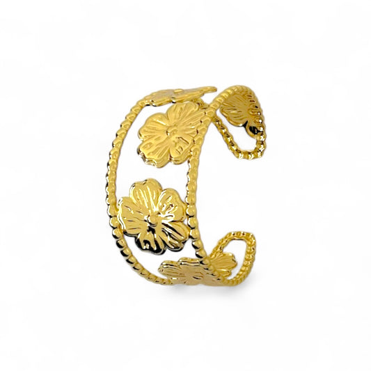 Golden open cuff bracelet with sculpted floral details and lace-like edges from Poshael.