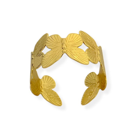Gold open cuff bracelet with detailed butterfly silhouettes wrapping around the band.